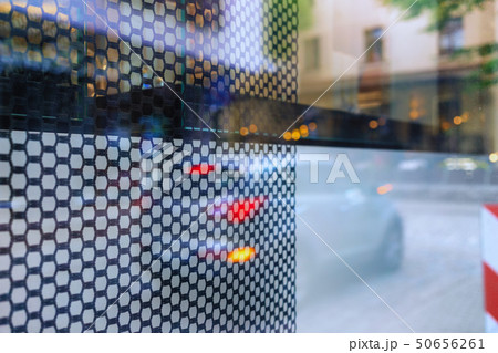 Reflection of street life in window glass Reflection of street life in window glass 50656261