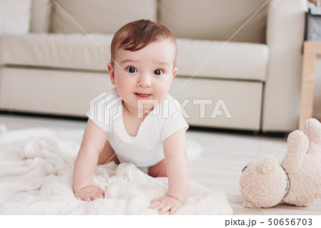 Charming little baby boy 6 months smiling and Charming little baby boy 6 months smiling and 50656703