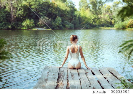 Beautiful woman in nature on the lake. Beautiful woman in nature on the lake. 50658504