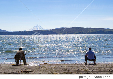 The fisherman sitting and fishing on the beach of 50661777