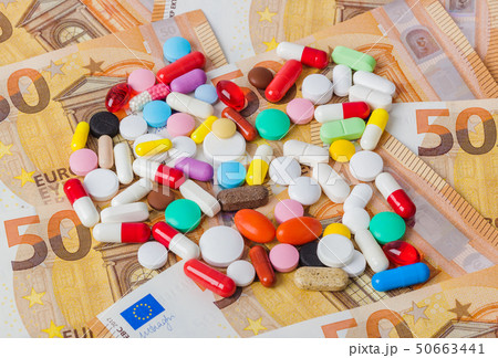 Pills and money - business medical background Pills and money - business medical background 50663441