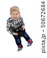 three-year boy sitting on a white background 50672684