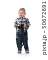 three-year boy with a camera in hand in the 50672691