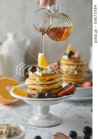 Delicious pancakes, with honey pouring. 50673564