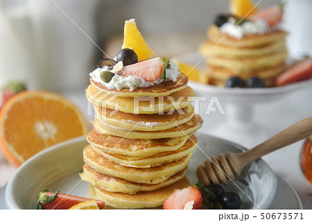 Close-up, Decorating a stack of pancakes. Close-up, Decorating a stack of pancakes. 50673571