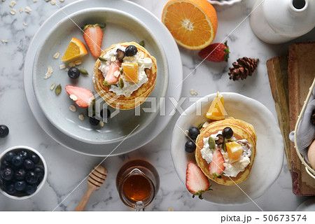 A white plate with homemade pancakes. top view A white plate with homemade pancakes. top view 50673574