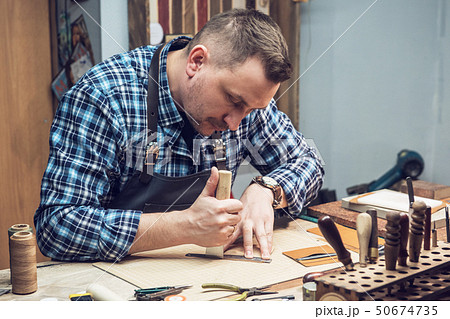 Concept of handmade craft production of leather goods. 50674735