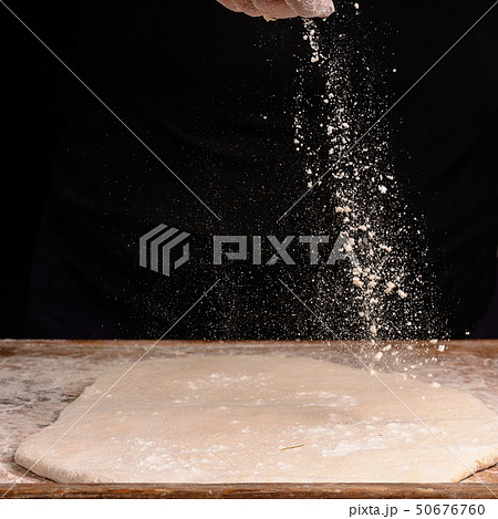 The hands of an old grandmother sprinkle with The hands of an old grandmother sprinkle with 50676760