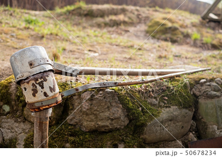 Scoop for drawing clean cold water from natural spring. Scoop for drawing clean cold water from natural spring. 50678234