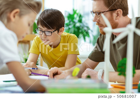 Inspired school group with teacher working on recreating poster 50681007