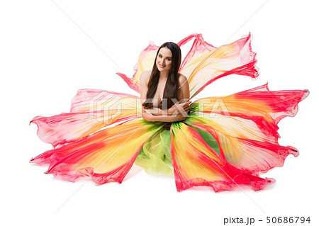 Beautiful brunette in flower style skirt view 50686794