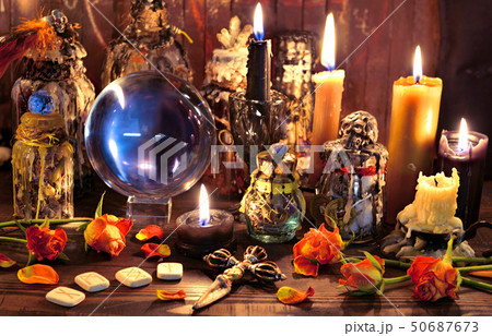 Witch bottles, black candles and roses  50687673