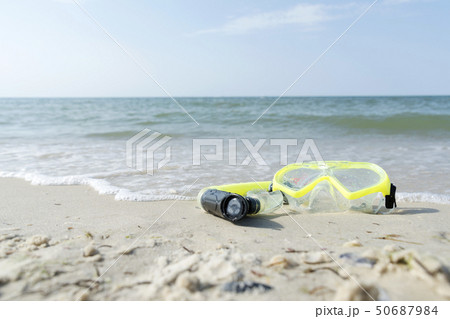 dive equipment on white sand beach in the sea shore 50687984