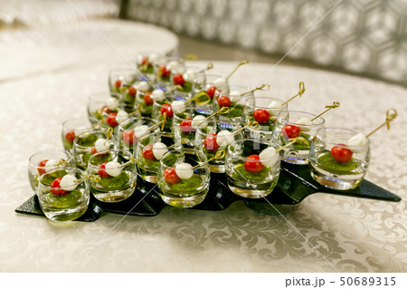 the buffet at the reception. Glasses of wine 50689315