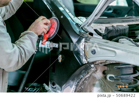 Car repair in car service. Mechanic worker Car repair in car service. Mechanic worker 50689422
