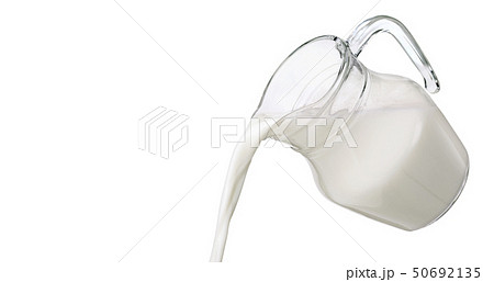 Pouring milk isolated on white background with clipping path 50692135