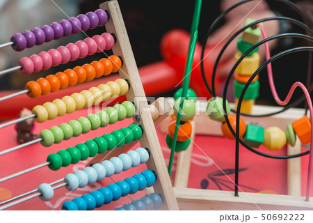 Colourful wooden abacus. Educational concept for kids. Learing to count. Wooden Toys ,intelligent Colourful wooden abacus. Educational concept for kids. Learing to count. Wooden Toys ,intelligent 50692222