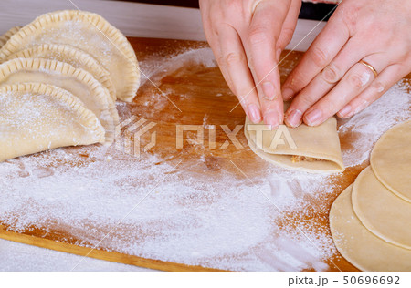 Making patties with cottage cheese ,meat and flour 50696692
