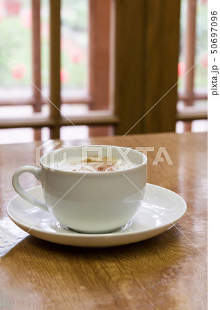 mug from a cappuccino on a wooden table mug from a cappuccino on a wooden table 50697096