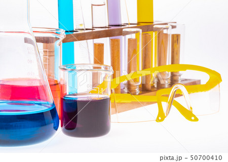 Colorful test tubes in wooden stand.. Colorful test tubes in wooden stand.. 50700410
