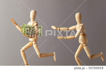 Stealing money. The thief with money runs away from the person 50700958