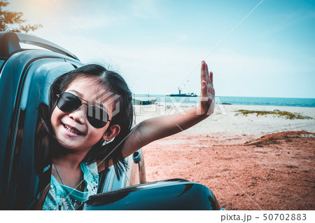 Asian child smiling with perfect smile in car. Asian child smiling with perfect smile in car. 50702883
