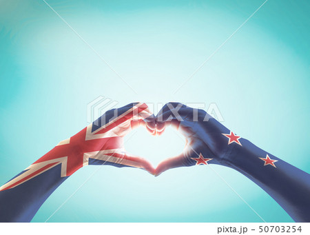 New Zealand flag pattern on people hands in heart New Zealand flag pattern on people hands in heart 50703254