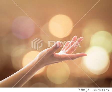 Women prayer hand reaching upward for holy spirit  50703475