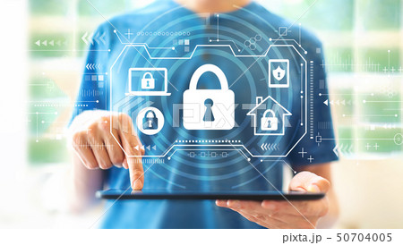 Security theme with man using a tablet Security theme with man using a tablet 50704005