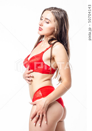 Beautiful, sexy, elegant blonde woman in red lingerie on a white background Beautiful, sexy, elegant blonde woman in red lingerie on a white background 50704143