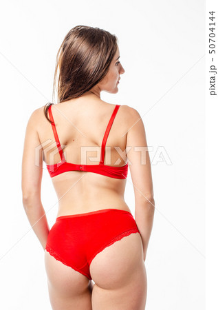 Beautiful, sexy, elegant blonde woman in red lingerie on a white background Beautiful, sexy, elegant blonde woman in red lingerie on a white background 50704144