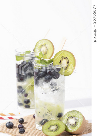 Kiwi cocktails beverage with ripe blueberry Kiwi cocktails beverage with ripe blueberry 50705677