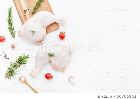 Fresh raw chicken legs with herbs. Cooking concept 50705952