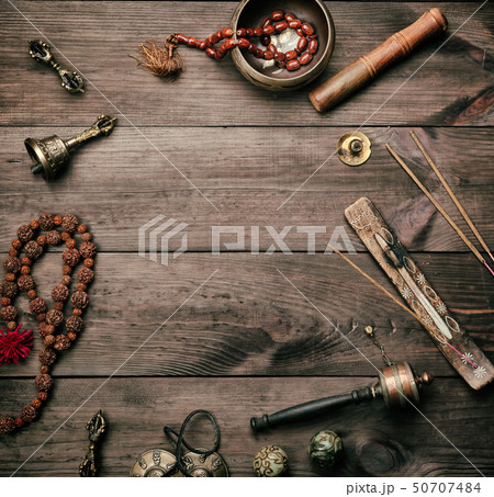 Copper singing bowl, prayer beads 50707484