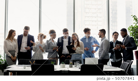 Business team having break, standing near window 50707841