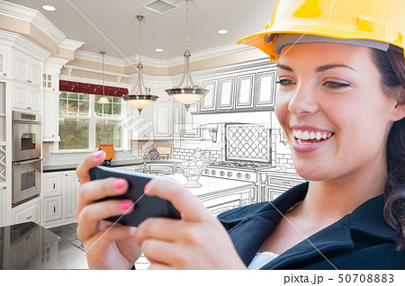 Female Contractor on Phone Over Kitchen Drawing Female Contractor on Phone Over Kitchen Drawing 50708883