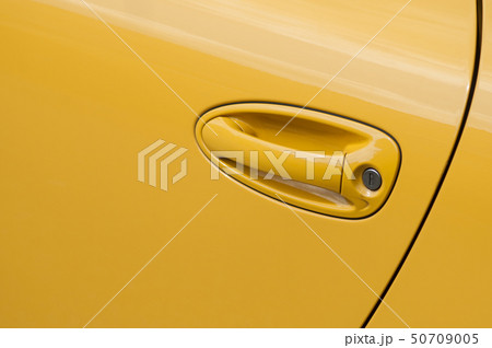 closeup of yellow handle on modern car closeup of yellow handle on modern car 50709005