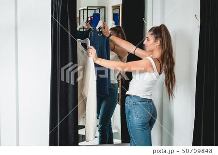 young beautiful woman shopping, going to fitting 50709848