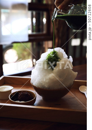 Delicious Japanese sweet shaved ice green tea on wooden table in japanese cafe 50712608