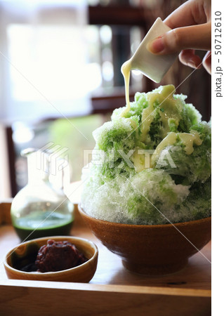 Delicious Japanese sweet shaved ice green tea on wooden table in japanese cafe 50712610