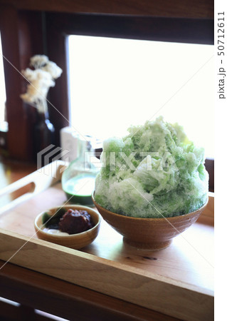 Delicious Japanese sweet shaved ice green tea on wooden table in japanese cafe 50712611