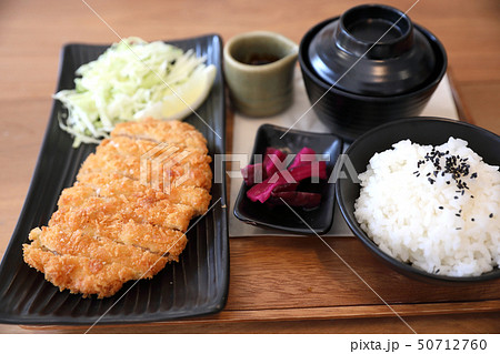 Tonkatsu fried pork cutlet with rice and soup on wooden table Japanese food Tonkatsu fried pork cutlet with rice and soup on wooden table Japanese food 50712760