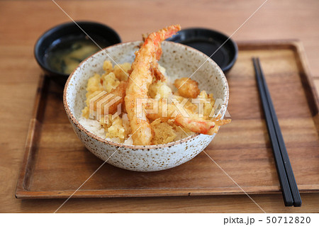 Tempura donburi , Fried shrimp tempura on rice japanese food on wooden table Tempura donburi , Fried shrimp tempura on rice japanese food on wooden table 50712820