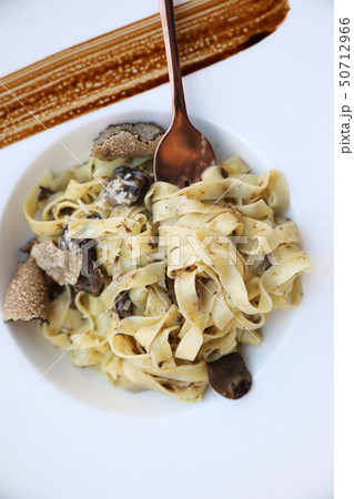 pasta with black truffles on wood background , Italian food pasta with black truffles on wood background , Italian food 50712966