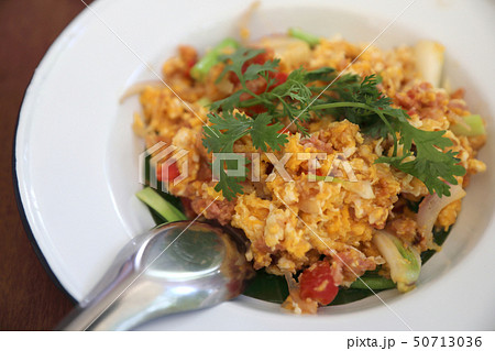 North Thai food Fried fermented sour pork and egg on wooden table 50713036