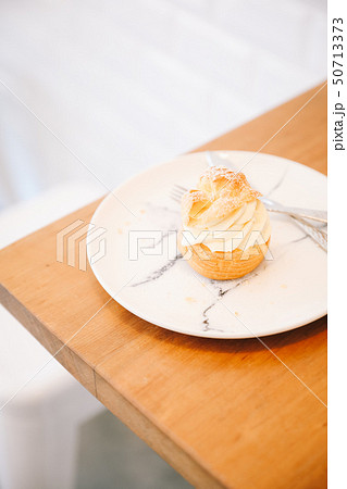 choux cream on wooden table 50713373