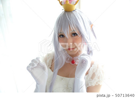 Portrait of vampire dracula young woman dress in white tone room halloween concept Portrait of vampire dracula young woman dress in white tone room halloween concept 50713640