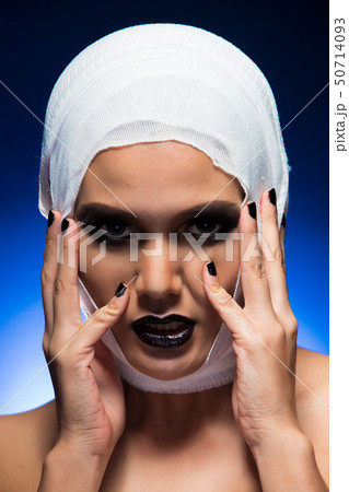 Woman with Bandage around head after brain beauty 50714093