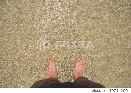 Male Standing in the Clear Sea Water. Male Standing in the Clear Sea Water. 50714266