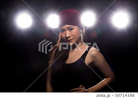 Fashion Asian Woman dark smoke back rim light 50714398